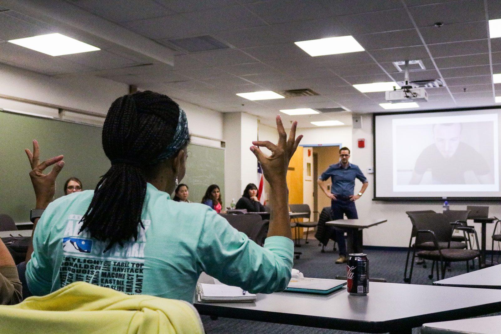 A student in professor Andrew Bottom’s American Sign Language 5 class practices signing. Boston University’s College of Arts and Sciences will count ASL as any other second language for its foreign language requirement. SOFIA KOYAMA/ DAILY FREE PRESS STAFF