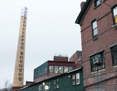 Robert Maloney's designs were used to restore the Haffenreffer Brewery's historic smokestack in Jamaica Plain. It had missed letters for three decades. PHOTO BY ABIGAIL FREEMAN/ DAILY FREE PRESS STAFF