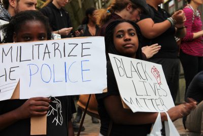 Protesters gather at Ruggles Station Friday evening for the Mass Action Against Police Brutality rally. PHOTO BY ABIGAIL FREEMAN/ DAILY FREE PRESS STAFF