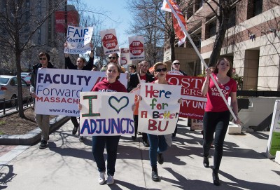 Protestors in support of higher wages for adjunct professors march down Commonwealth Avenue toward President Brown’s office. PHOTO BY LEXI PLINE/DAILY FREE PRESS STAFF