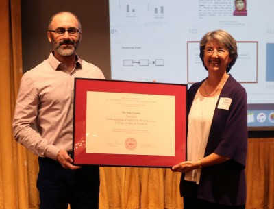 Paul Lipton, director of the Undergraduate Research Opportunities Program, receives a BU Undergraduate Academic Advising Award on Friday. PHOTO BY ANNALYN KUMAR/DAILY FREE PRESS STAFF