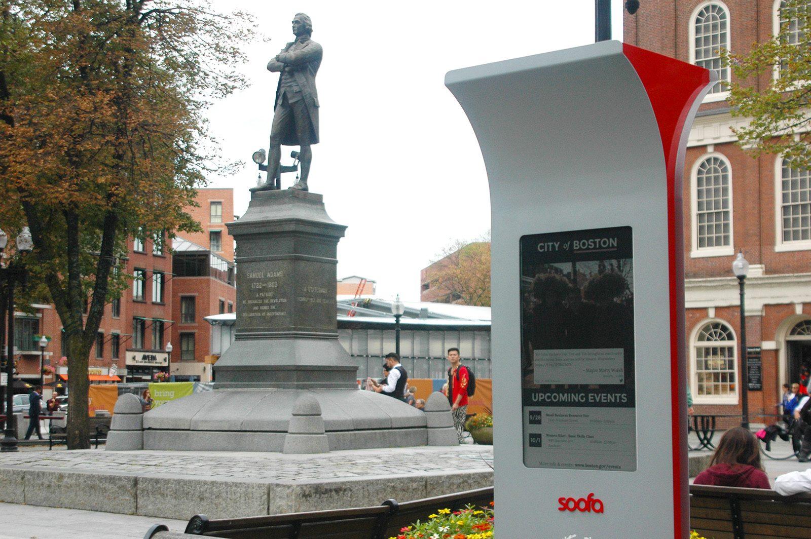The solar-powered Soofa Bench in Samuel Adams Park was unveiled Friday by Boston Mayor Martin Walsh as an interactive platform for visitors. PHOTO BY ALEX MASSETT/ DAILY FREE PRESS STAFF