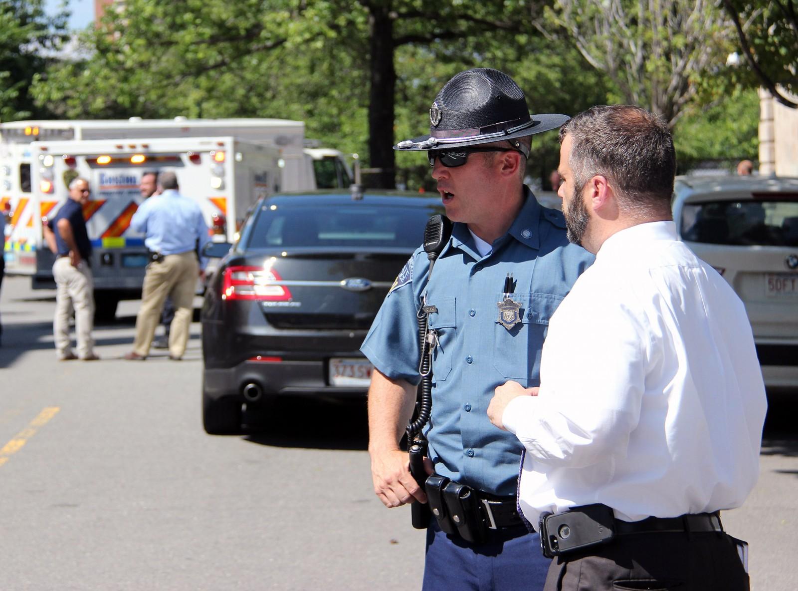 Authorities gather on Silber Way after a fatal shooting by state troopers Friday afternoon. PHOTO BY ALEXANDRA WIMLEY/DAILY FREE PRESS STAFF
