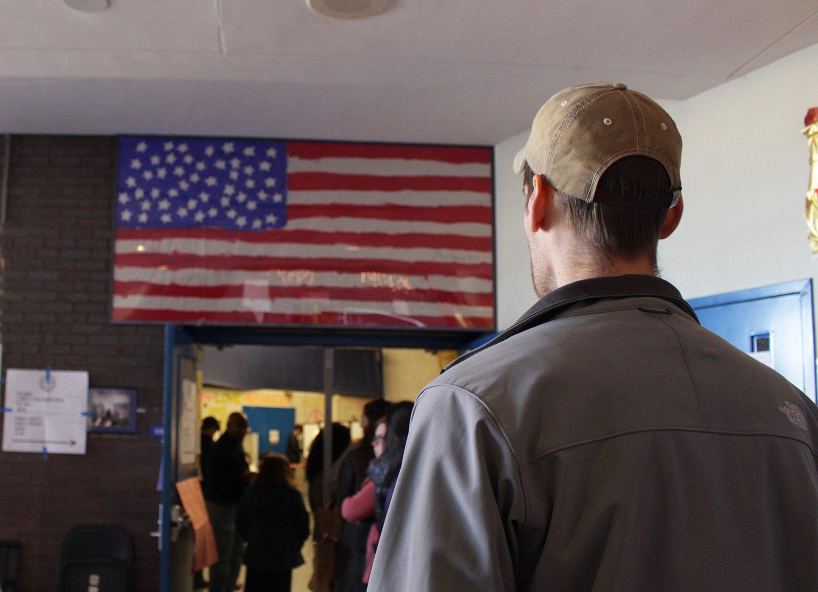 People stand in line to vote at the Jackson/Mann K-8 School in Allston. PHOTO BY BRIGID KING/ DAILY FREE PRESS STAFF 