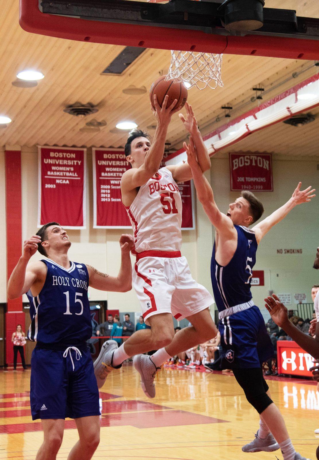 Senior forward and captain Max Mahoney, shown in the Feb. 8 game against College of the Holy Cross, leads the Terriers in points and rebounds per game as Boston University sits in second place in the Patriot League. ANRAN XIE/ DFP FILE