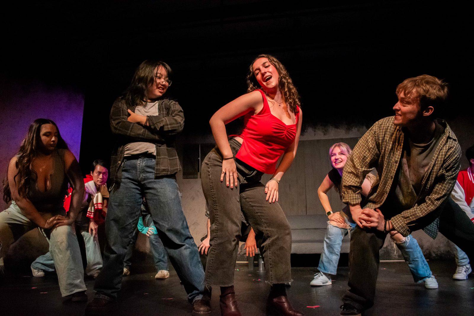 Boston University Stage Troupe members Sofia Lipsanopolous, Mai Nguyen, Seven Zhang, Jess Kaplan, Reese Hotten-Somers and Ethan Palmersheim (left to right) performing the song “The World According to Chris” from “Carrie: The Musical.” BU Stage Troupe performed “Carrie” from Oct. 31 to Nov. 2 at the Student Theater at Agganis Arena. COURTESY OF KELLY BRODER 

