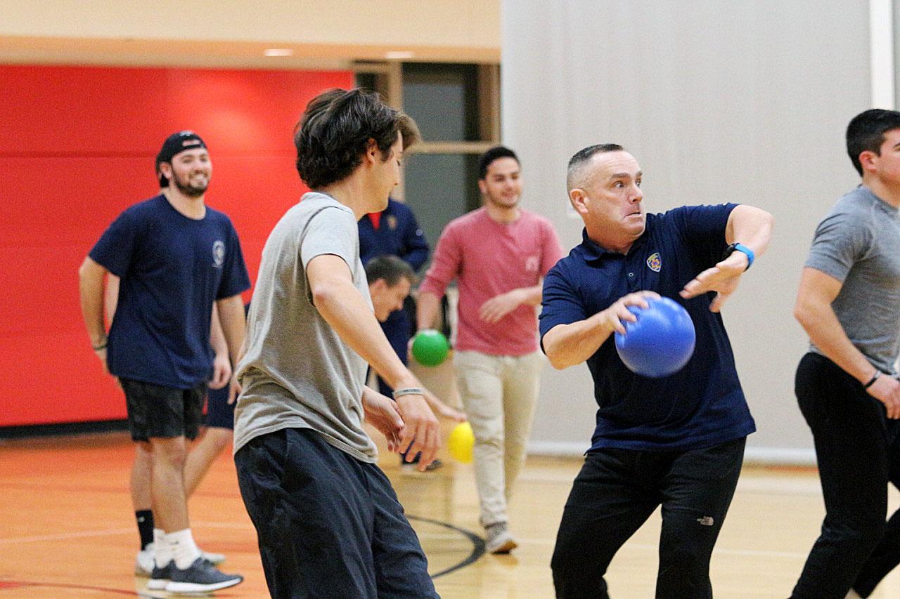 Officers from the Boston University Police Department and students involved in Greek Life took part in a dodgeball game Wednesday evening as part of the department’s annual Police Week. MADISON EPPERSON/ DAILY FREE PRESS STAFF