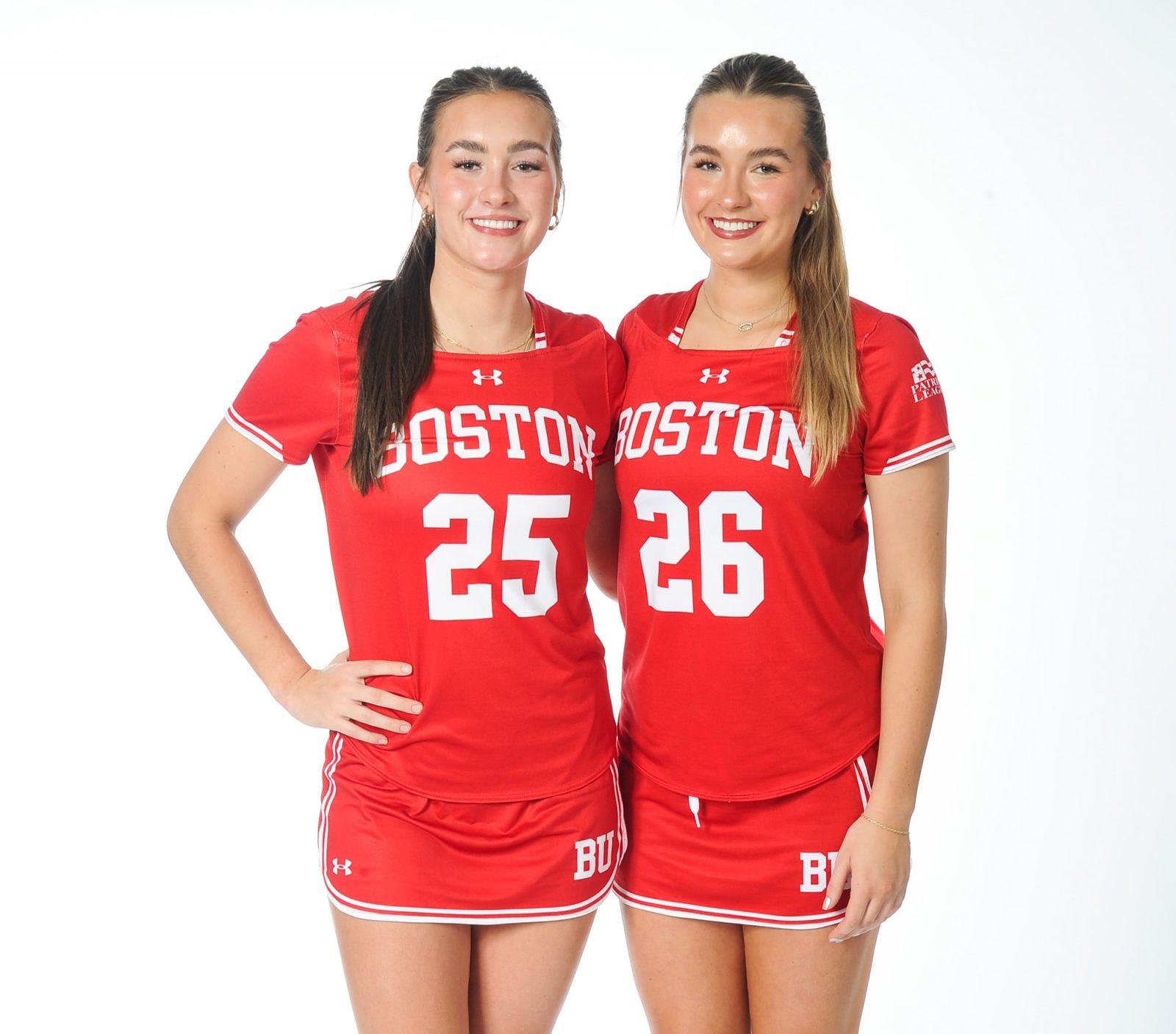 Junior defense Siri Hodgins (25) and junior midfielder Leah Hodgins (26). The Hodgins twins are both on the Boston University women’s lacrosse team. COURTESY OF BU ATHLETICS