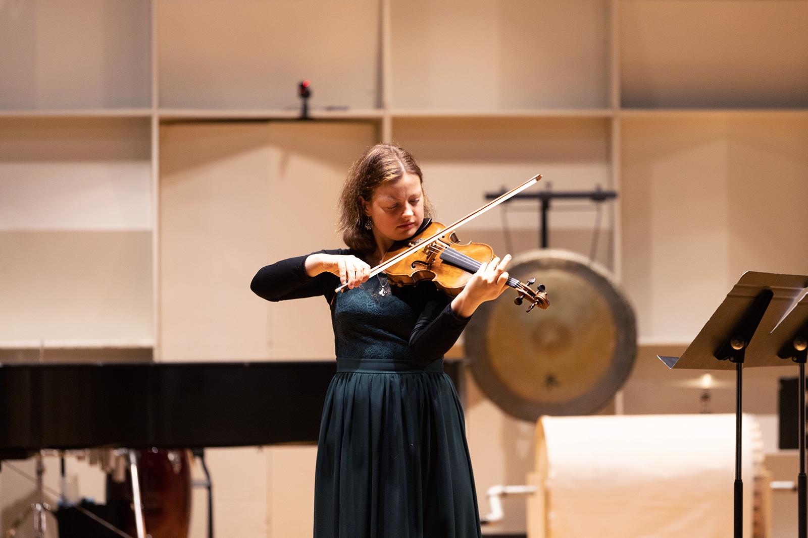 Boston University College of Fine Arts alumnus Aija Reke performs “Memoire de Claire,'' an Olivier Messiaen-inspired piece written by BU student Elena Levi, at the “Charm of Impossibilities” Concert in the CFA Concert Hall Sunday. BAILEY SHEN/ DAILY FREE PRESS STAFF