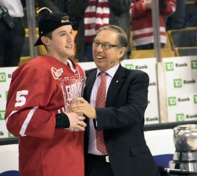 Junior defenseman Matt Grzelcyk is awarded the Beanpot Tournament's Most Valuable Player Award after he scored in overtime to help the No.4 Boston University men's hockey team defeat Northeastern University 4-3. PHOTO BY JUSTIN HAWK / DAILY FREE PRESS STAFF