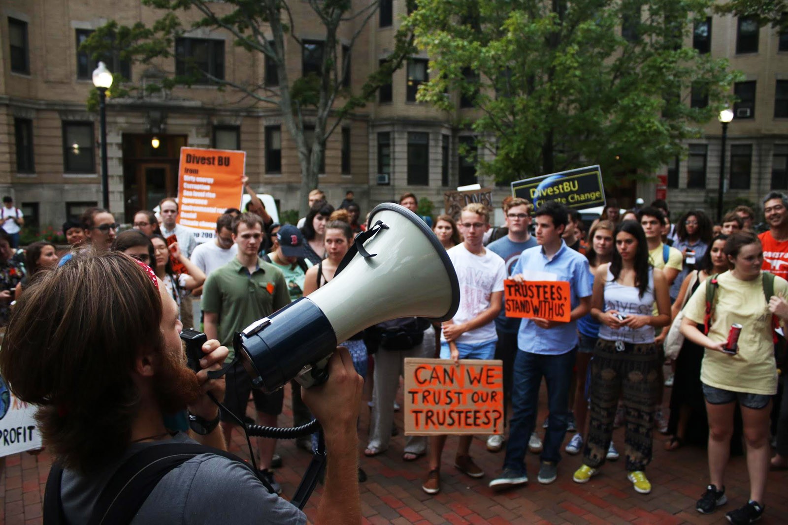 Members of Divest BU gather in front of the BU Castle to protest the Board of Trustees’ investment in fossil fuels. PHOTO BY BETSEY GOLDWASSER/ DAILY FREE PRESS STAFF 