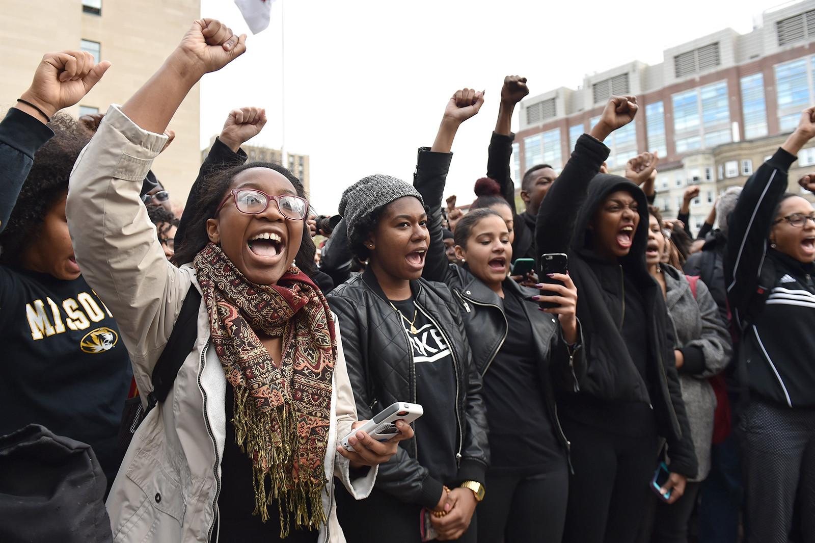 Boston University students Gloria Ihenetu, CGS ’19, and Ashley Guillaume, CAS ’17, participate in a “Black Out” protest in Marsh Plaza Friday to show support of the students of color at the University of Missouri. PHOTO BY MADDIE MALHOTRA/DAILY FREE PRESS STAFF
