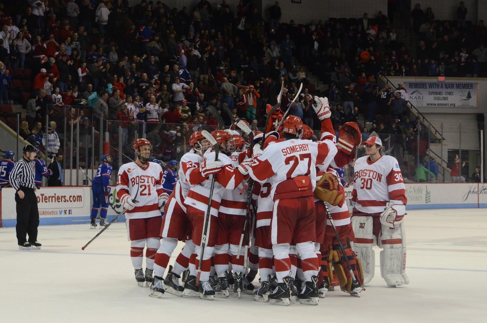 The No. 2 Boston University men's hockey team celebrates freshman Jack Eichel's game-winning overtime goal against UMass Lowell. 
PHOTO BY DANIEL GUAN/DAILY FREE PRESS STAFF