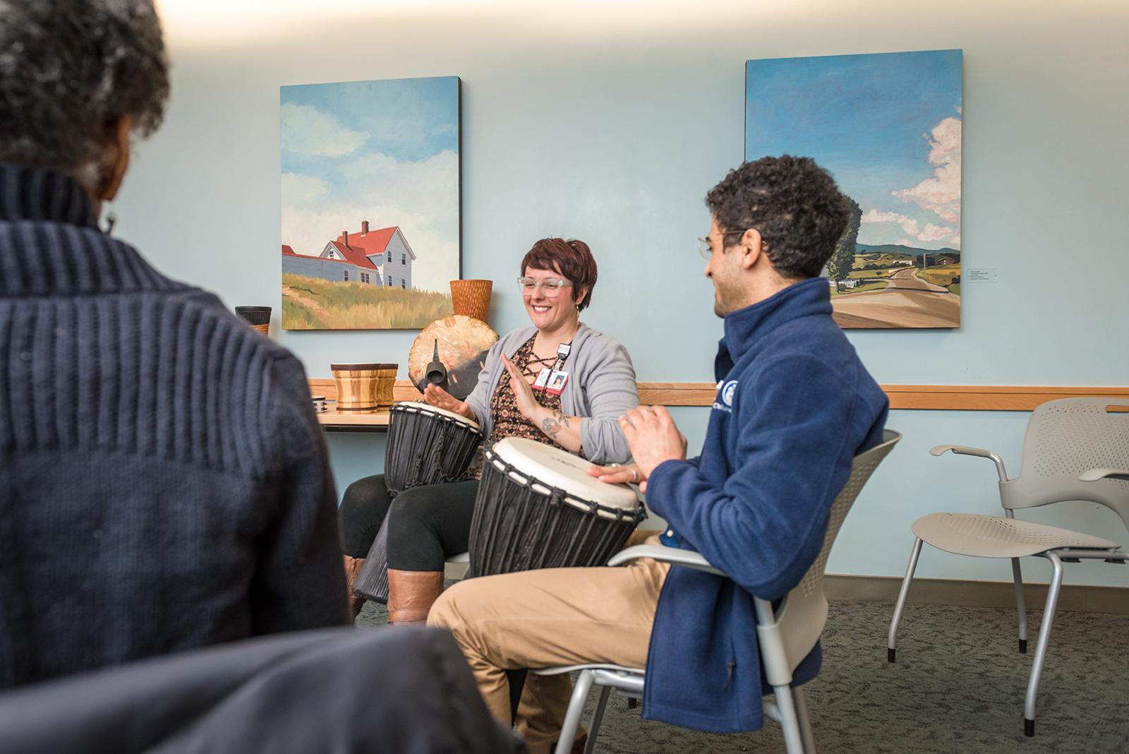 Musical Therapist Heather Lea Woods hosts a drum circle with patients at the Dana-Farber Cancer Institute’s Zakim Center for Integrative Therapies in Boston. COURTESY OF DANA-FARBER CANCER INSTITUTE