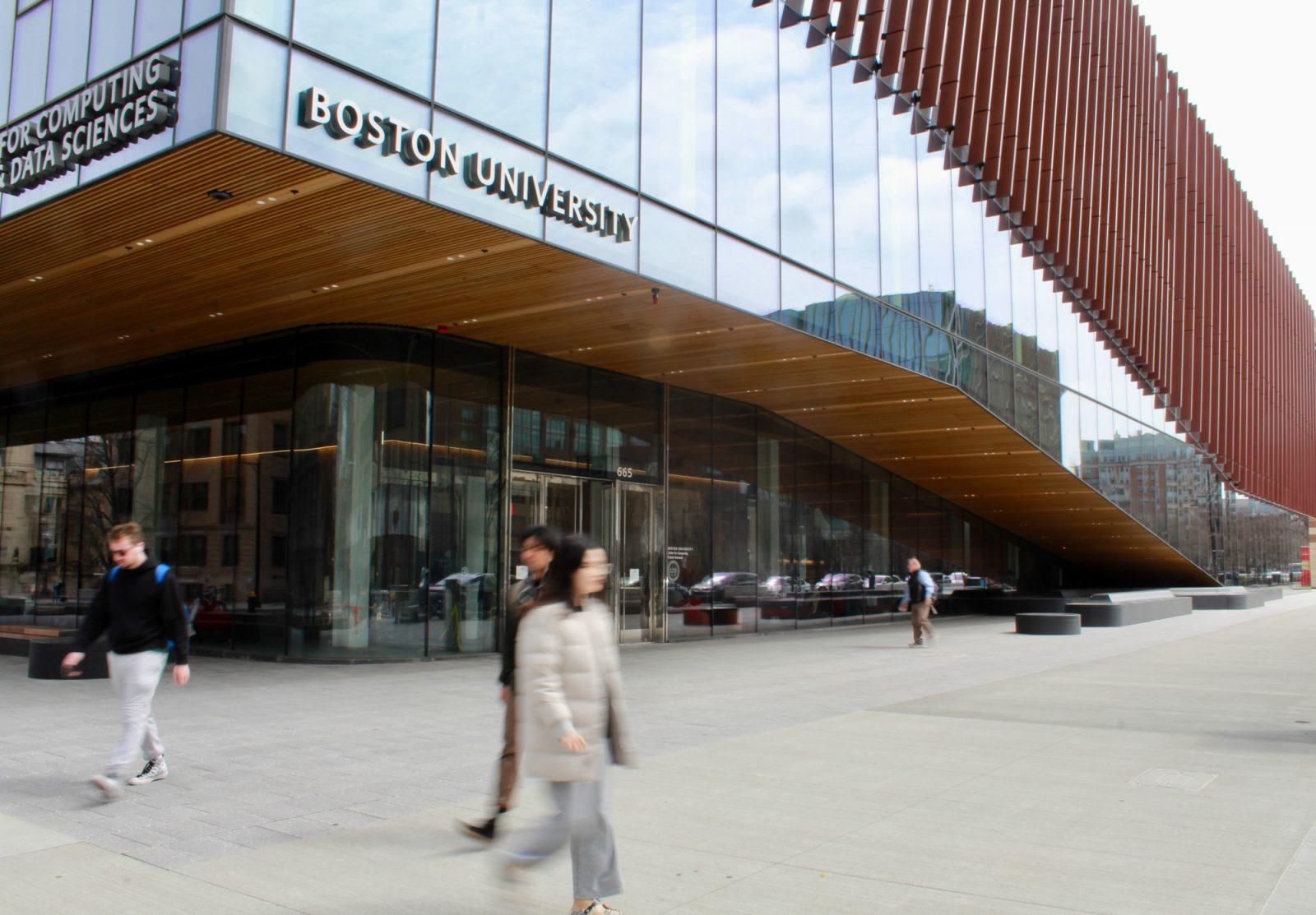 Students walk by the Center for Computing and Data Sciences. The PILOT program requests that tax-exempt educational institutions, such as Boston University, make voluntary payments to support community and city services. SARAH CRUZ/DFP PHOTOGRAPHER