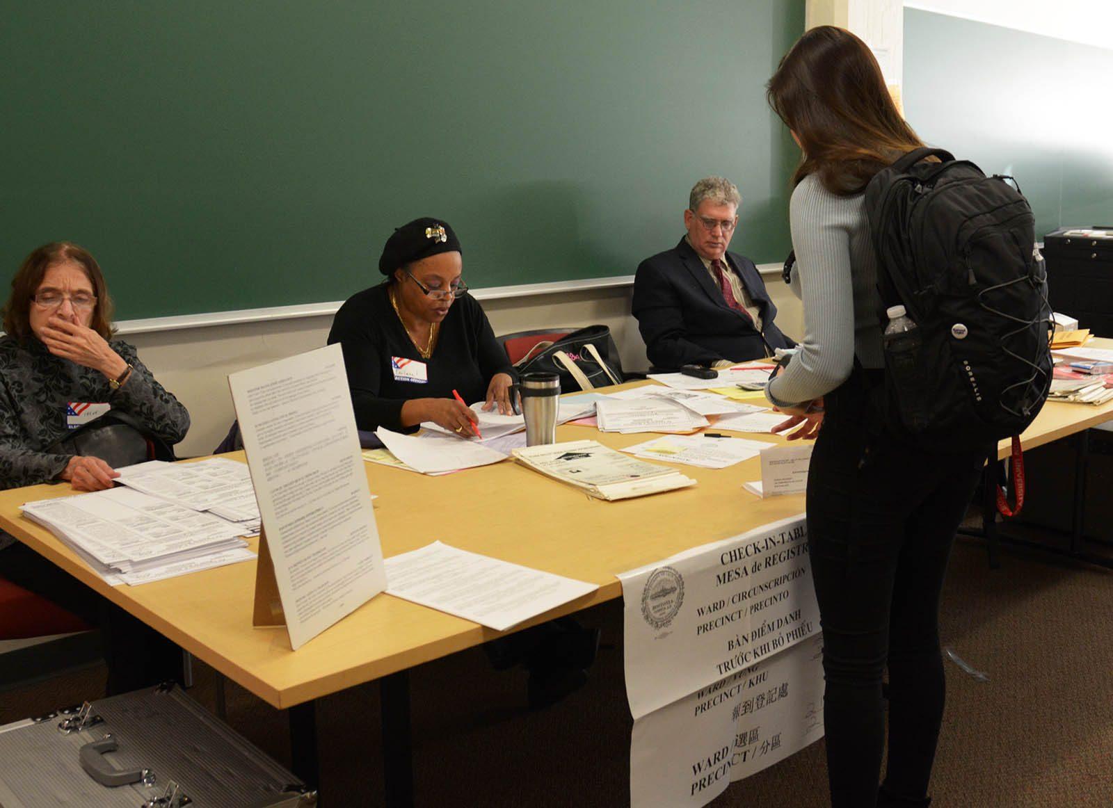 A student signs in to vote on campus at 111 Cummington Mall.  PHOTO BY JESS RICHARDSON/ DAILY FREE PRESS STAFF 