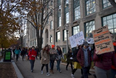Students walk down Commonwealth Avenue for a Divest BU march Thursday afternoon. PHOTO BY CHLOE GRINBERG/ DAILY FREE PRESS STAFF 