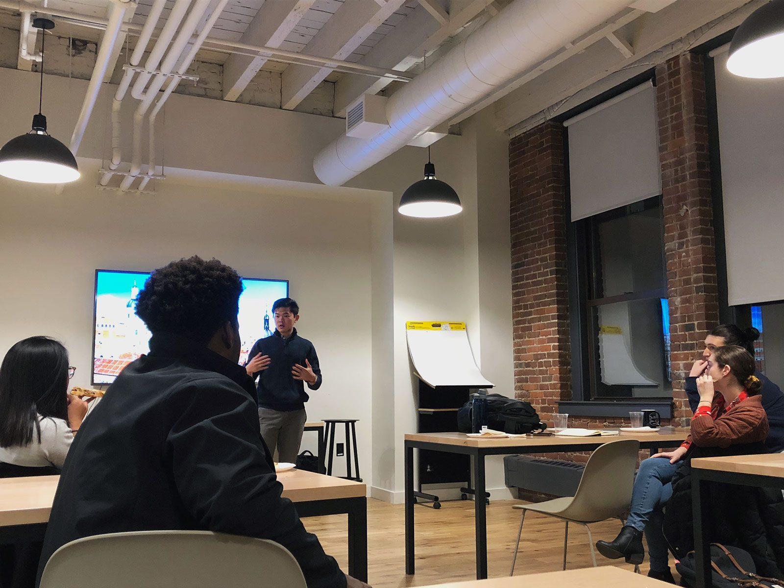 A student makes his pitch at a workshop Thursday co-hosted by UNIfy and DryErase Ventures at WeWork. ED MISKA/ DAILY FREE PRESS STAFF