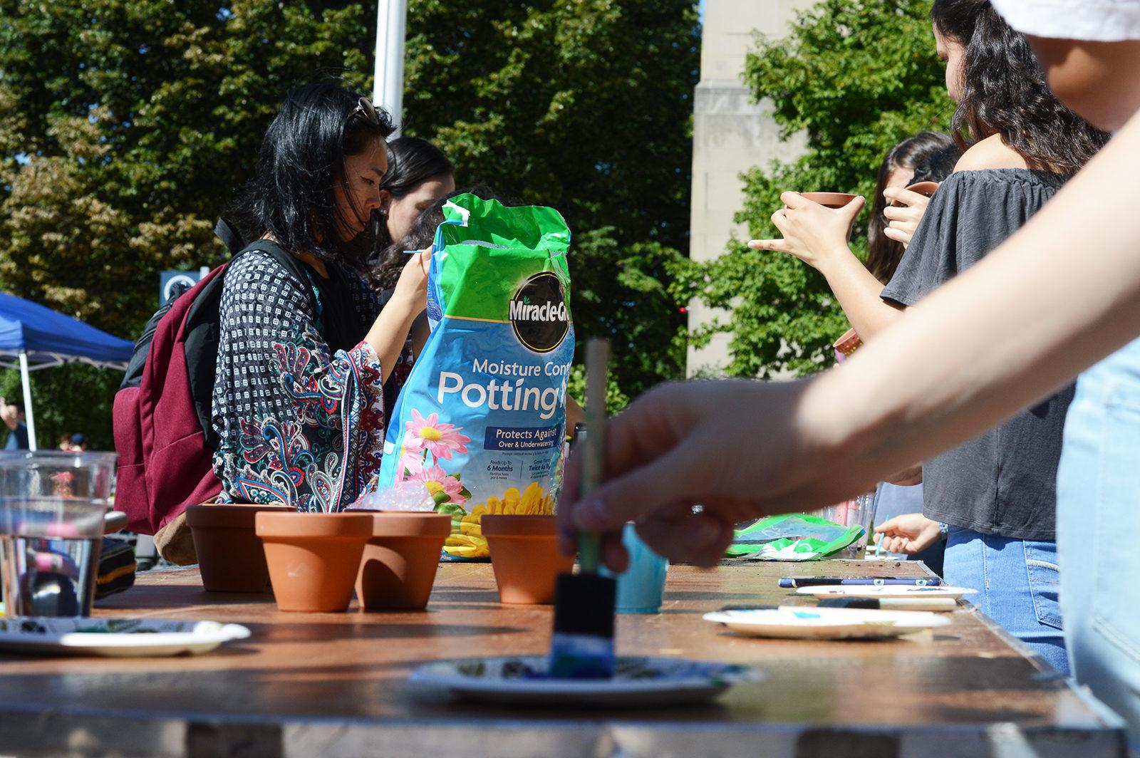 Marsh Chapel hosts “The Greening of the Dorms” Friday, welcoming students to paint pots, fill them with soil and plant basil. PHOTO BY VIGUNTHAAN THARMARAJAH/ DAILY FREE PRESS STAFF
