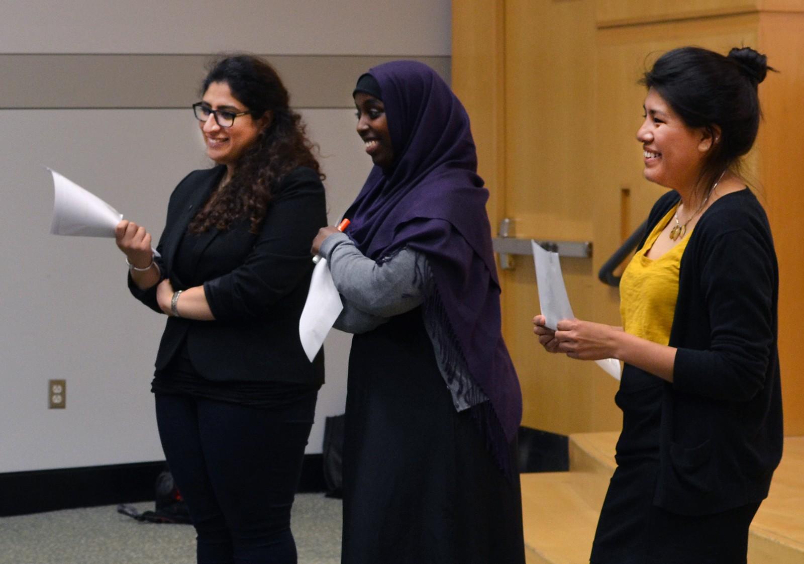 Noor Toraif (CAS '16), Amina Egal (CGS '17) and Kimberly Barzola (CAS '17) lead “Town Hall: Fight for the African Presidential Center,” a meeting to discuss the closing of the center, Monday at the Boston University Photonics Center. PHOTO BY WILLA RUSOWICZ-ORAZEM/DAILY FREE PRESS STAFF