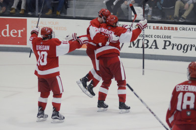 BU celebrates senior winger Ahti Oksanen's game-tying goal against No. 1 Providence College. PHOTO BY FALON MORAN/DAILY FREE PRESS STAFF