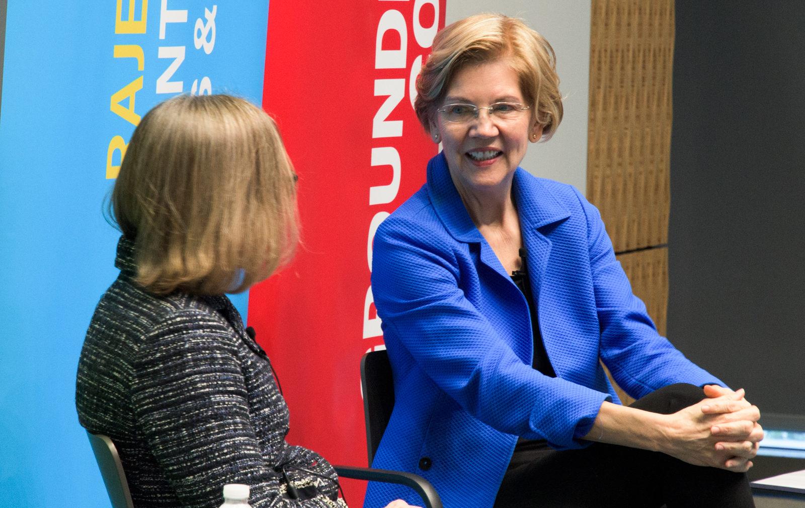Senator Elizabeth Warren speaks to College of Arts and Sciences Dean Ann Cudd at the Rajen Kilachand Center for Integrated Life Sciences and Engineering about public health Monday afternoon. PHOTO BY CHLOE GRINBERG/ DAILY FREE PRESS STAFF
