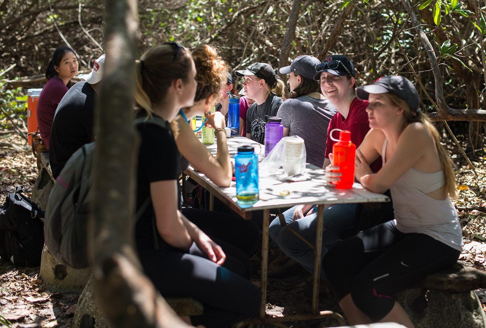 Boston University alternative service break participants take a break during volunteering in Hobe Sound, Florida last week. PHOTO BY MICHAEL DESOCIO/DAILY FREE PRESS STAFF