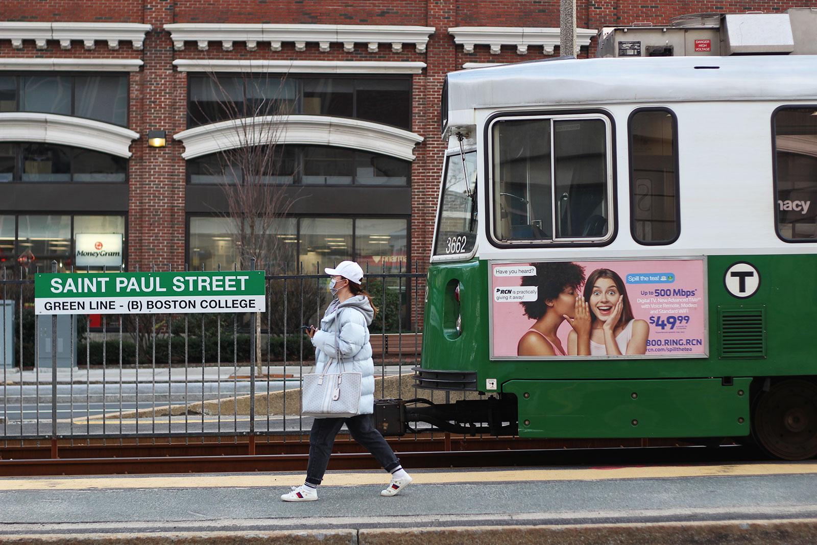 A person walks past a Green Line train departing Saint Paul Street station. HANNAH YOSHINAGA/ DFP FILE