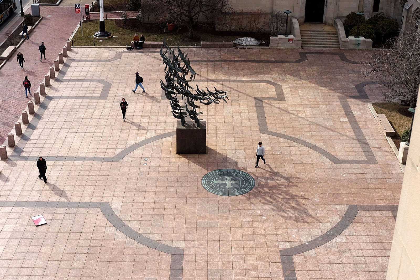 Boston University’s Marsh Plaza. Boston University is suspending contributions to its employees’ retirement plans for fiscal year 2021 due to expenses incurred as a result of the coronavirus. RODRIGO DE LA PLAZA/ DFP FILE