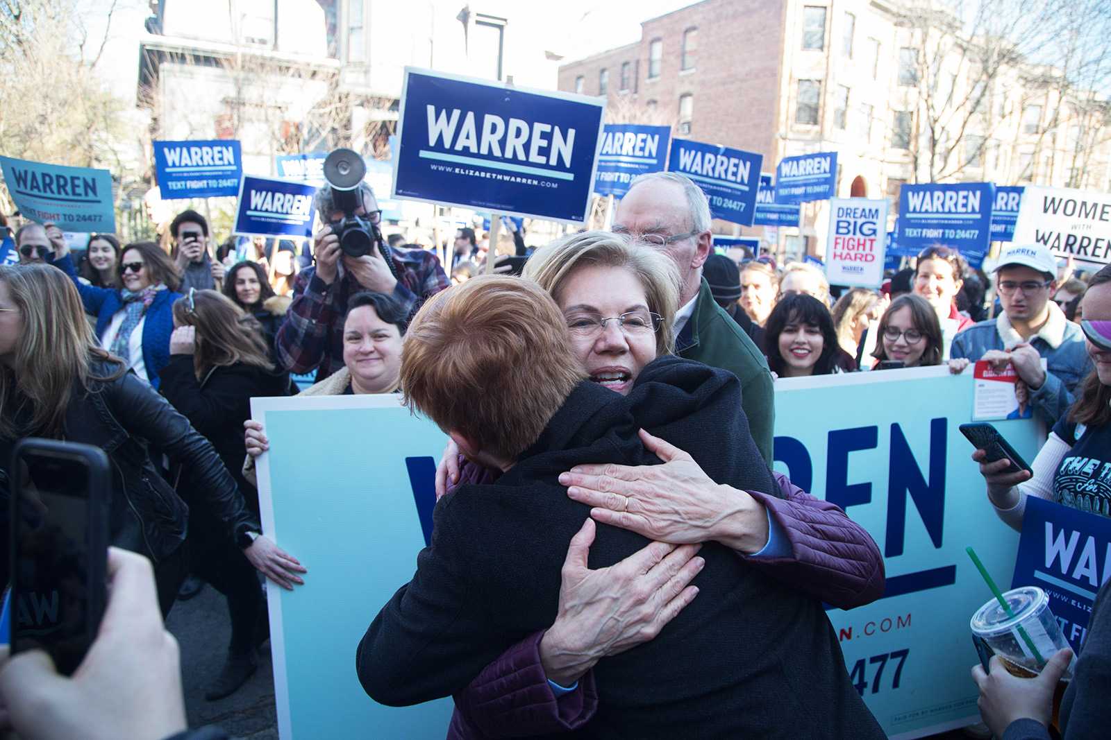 Sen. Elizabeth Warren embraces a supporter during her visit to Cambridge, where she voted in the Massachusetts primary Tuesday morning. VIGUNTHAAN THARMARAJAH/ DAILY FREE PRESS STAFF