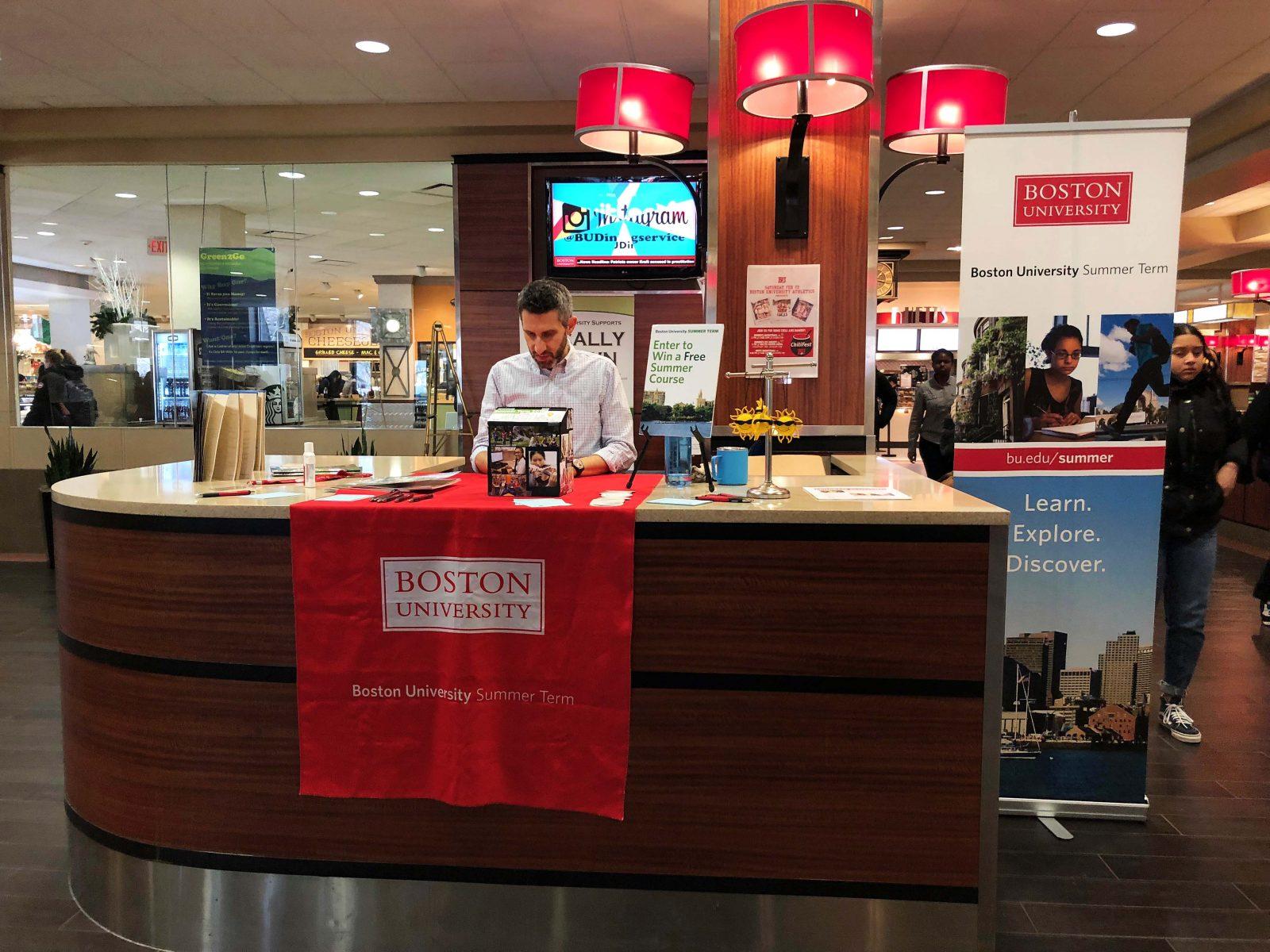 A person sets up a summer session pop-up booth in the George Sherman Union on Saturday. BU’s pre-summer programs have been named among the top 30 pre-summer programs in the United States. GABRIELA HUTCHINGS/ DAILY FREE PRESS STAFF