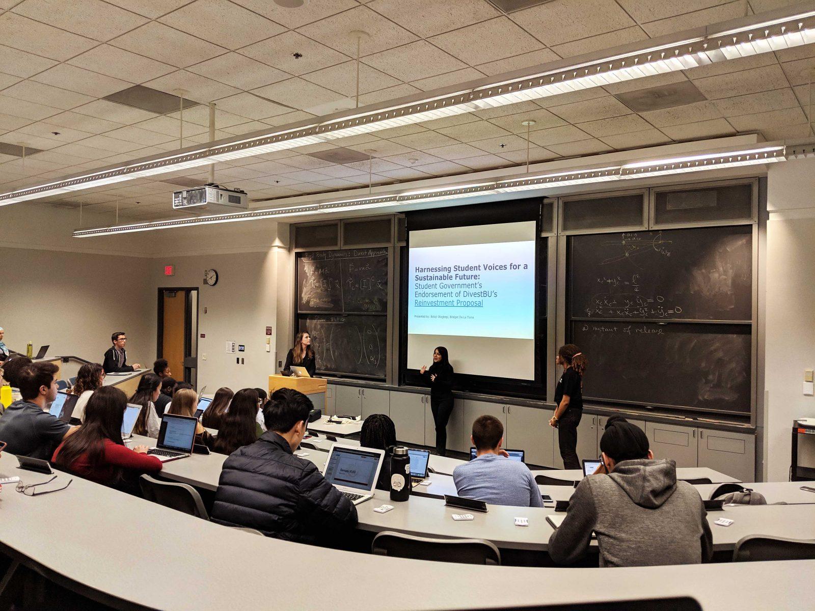 Bolaji Olagbegi and Bridget De La Torre present their divestment proposal to BU Student Government’s Senate Monday night. GRANT HILLYER/ DFP STAFF