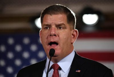 marty walsh speaking into a microphone