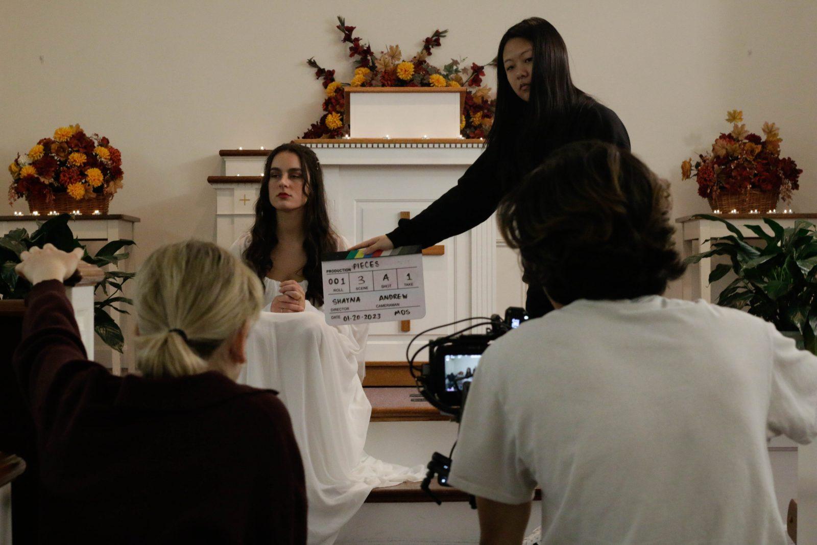 Person being filmed in a movie scene