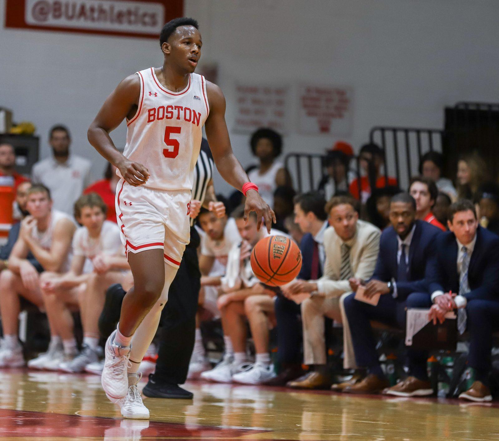 Sophomore guard Kyrone Alexander (5) dribbles the ball during a game against Northeastern on Nov. 4. The Boston University men’s basketball team beat Holy Cross on Monday night at Case Gym. KATE KOTLYAR/DFP PHOTOGRAPHER
