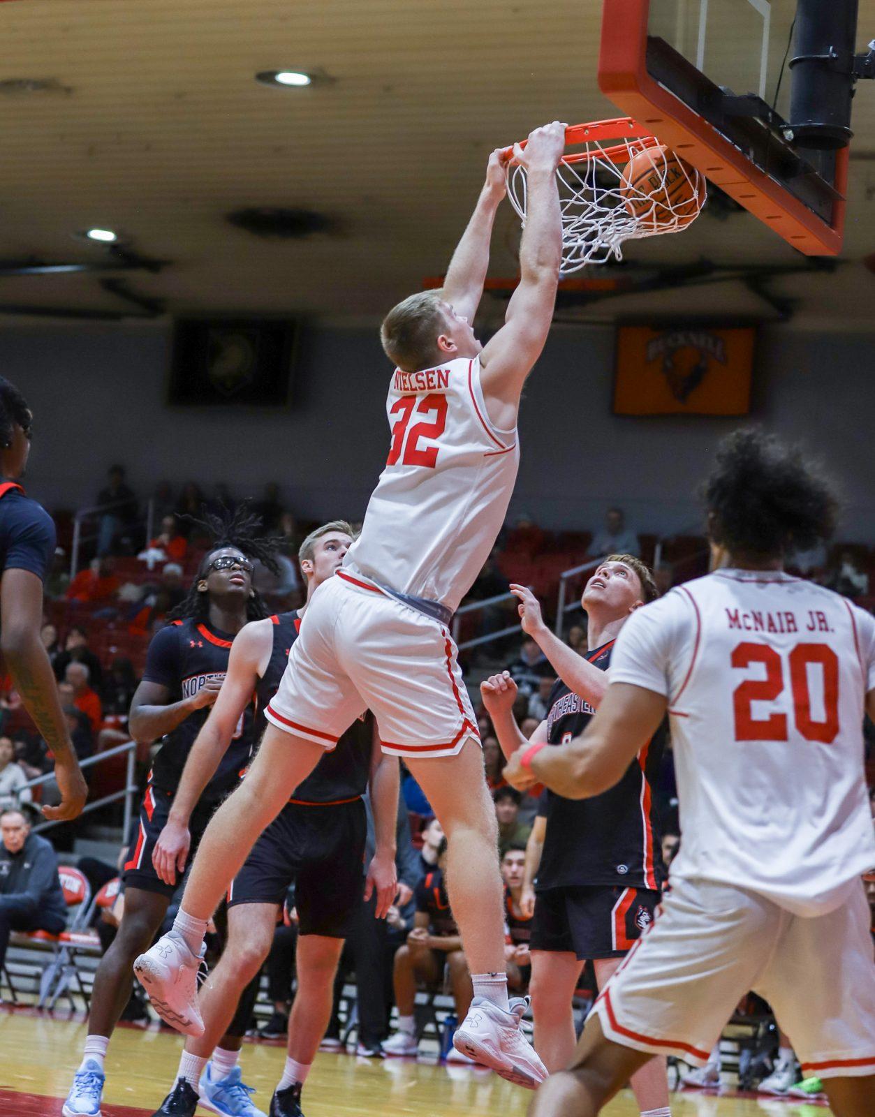 Sophomore forward Quinn Nielsen (32) dunks the ball during the men’s basketball game on Nov. 4. The Boston University men’s basketball team lost to the University of San Diego on Friday. KATE KOTLYAR/DFP PHOTOGRAPHER 
