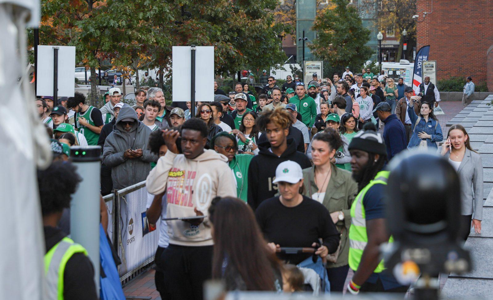 Celtics fans wait in line outside Boston City Hall Plaza at the start of the NBA Tip-Off event on Tuesday. The event, hosted by TNT Sports, featured performances by Shaboozey and Benson Boone, and was anchored by the “Inside the NBA” studio team. KATE KOTLYAR/DFP PHOTOGRAPHER
