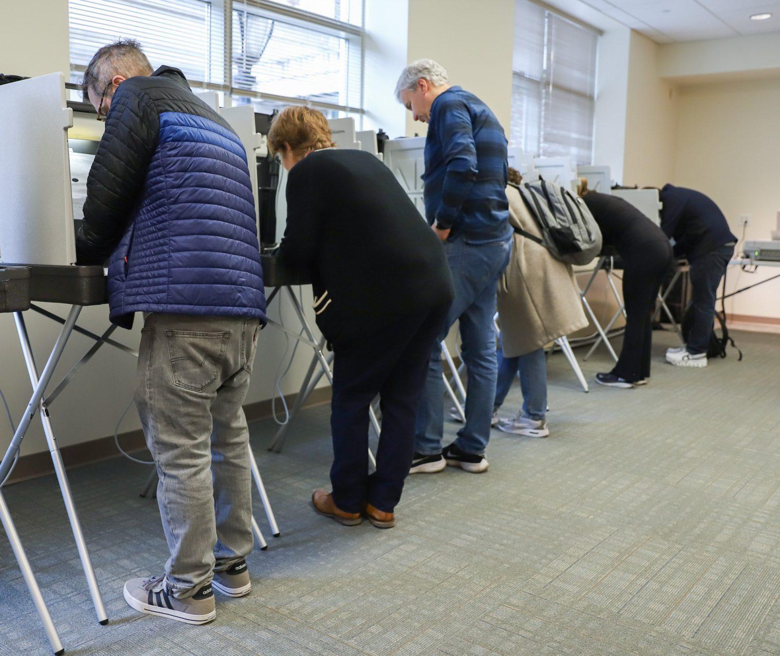 People voting at Precinct 1 in Brookline, Massachusetts. Voters and political committees are divided on the impact of people voting for third-party candidates in the presidential election. KATE KOTLYAR/DFP PHOTOGRAPHER 