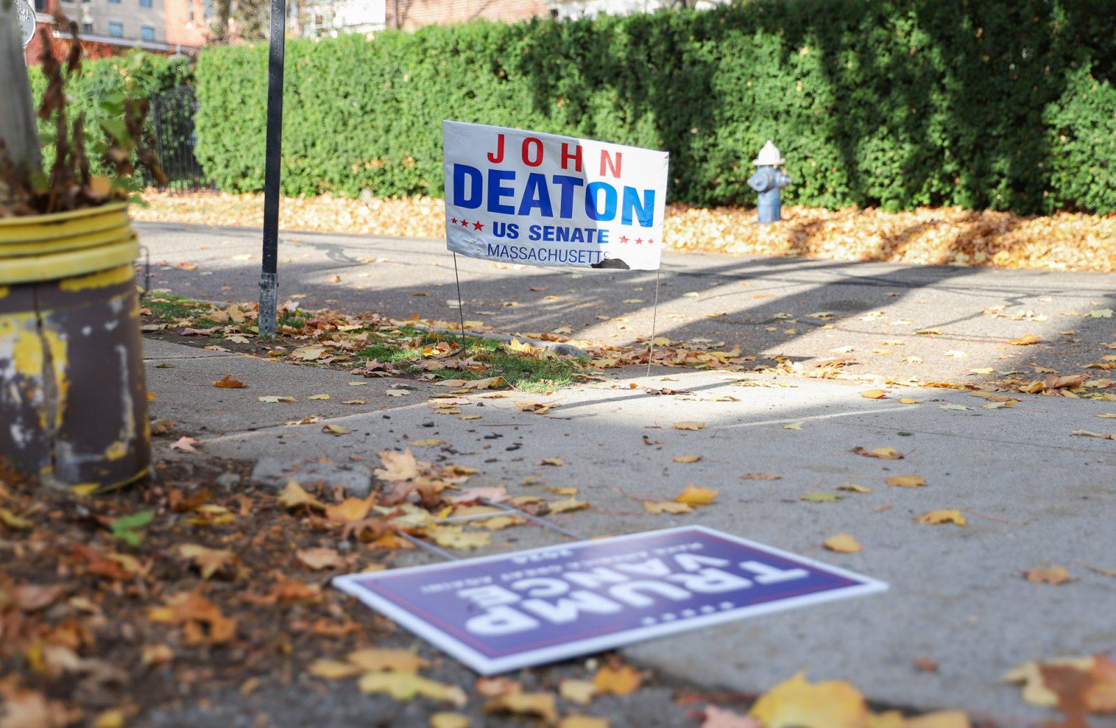 Signs for Massachusetts senate candidate John Deaton, presidential candidate and vice president Donald Trump and JD Vance in Brookline, Massachusetts. Increased political divide has affected families and communities in Boston. KATE KOTLYAR/DFP PHOTOGRAPHER 