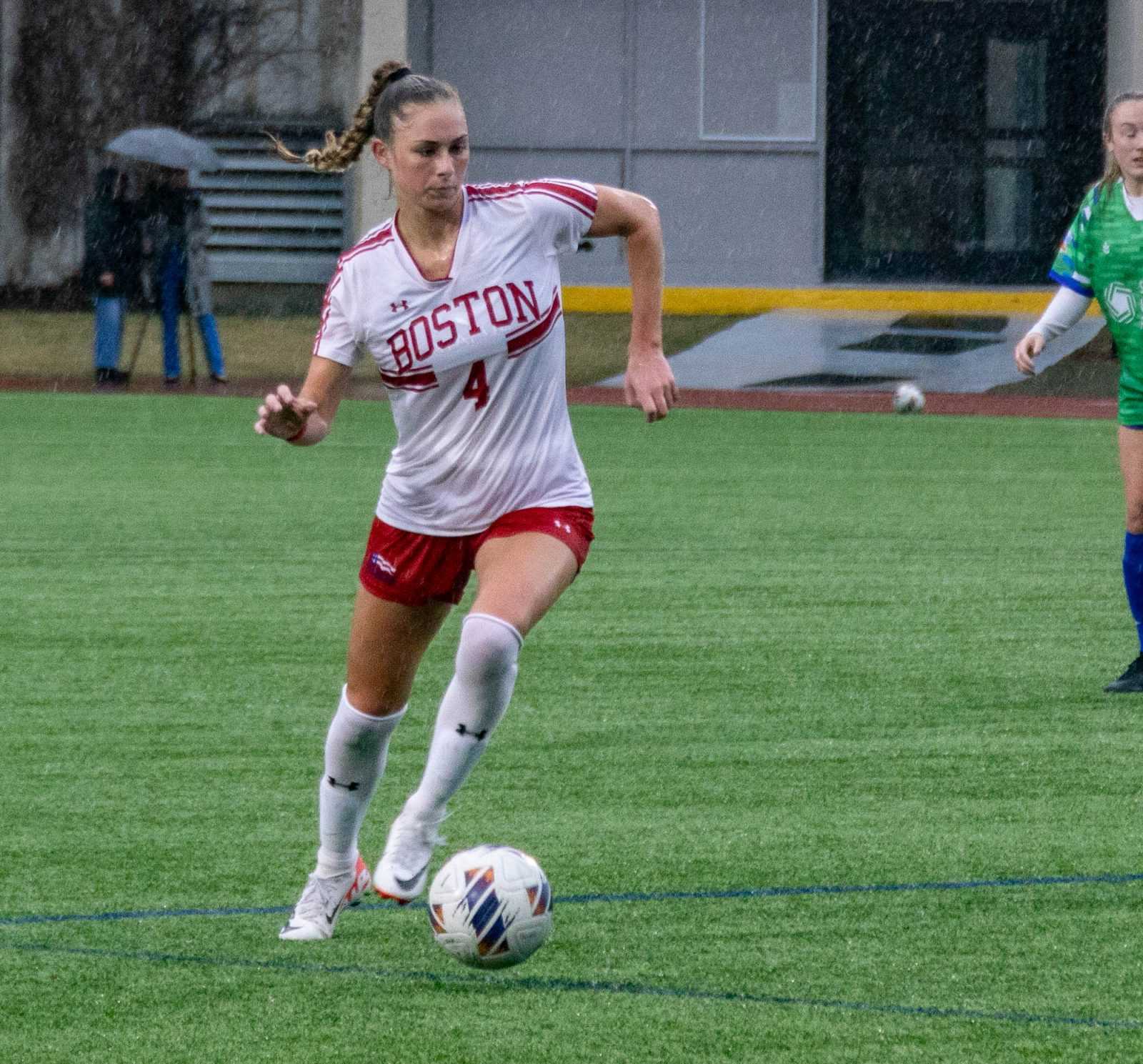 Junior midfielder Mackenzie Stickleman (4) runs with the ball in a game against the Boston Dream on March 23. The women’s soccer team lost 1-0 to the University of New Hampshire in New Hampshire on Sunday. KATE KOTLYAR/DFP PHOTOGRAPHER