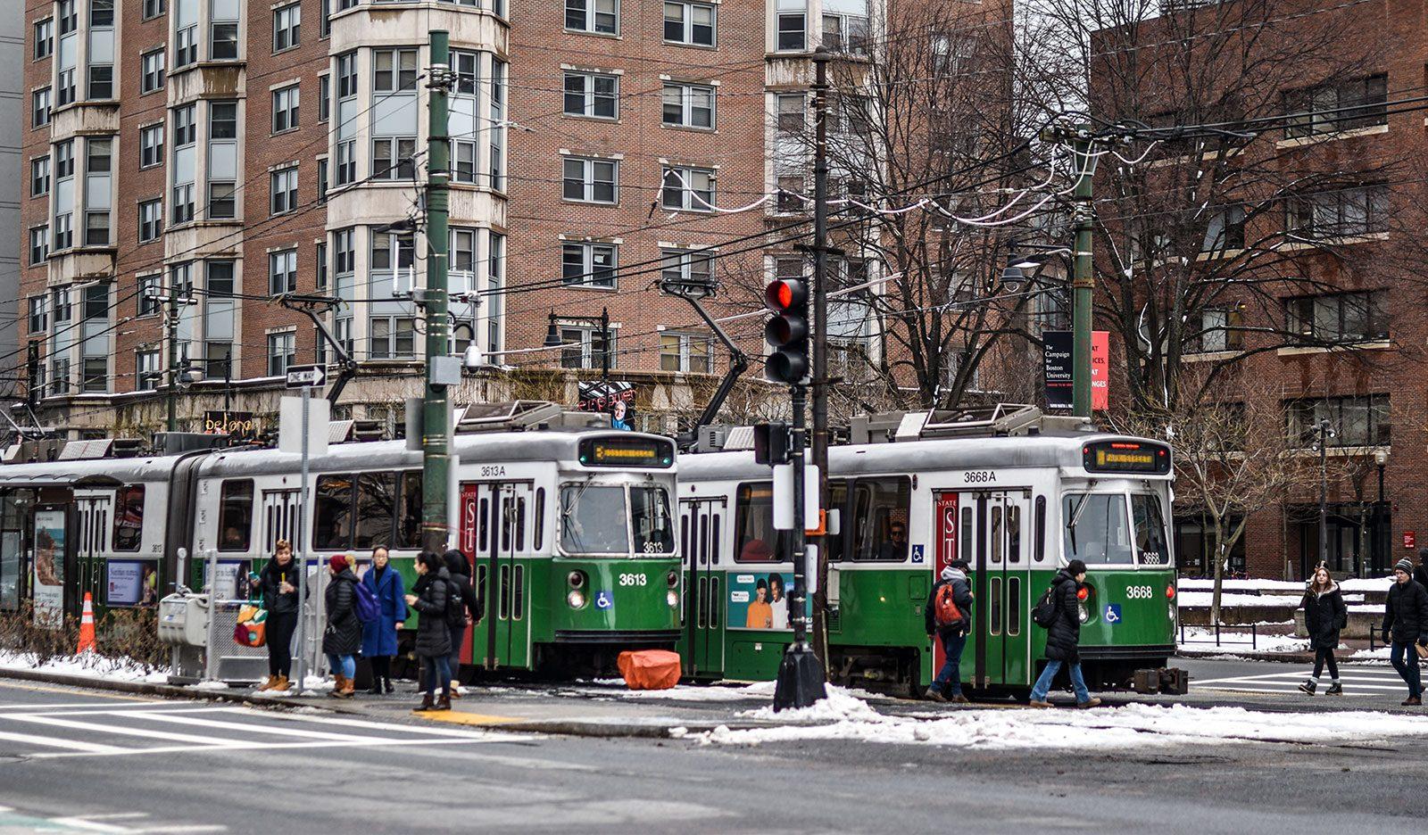 Two green line trains at the Blandford Street stop on Commonwealth Avenue. Boston University subsidizes half of the costs of monthly MBTA passes for its employees. LAURYN ALLEN/ DAILY FREE PRESS STAFF