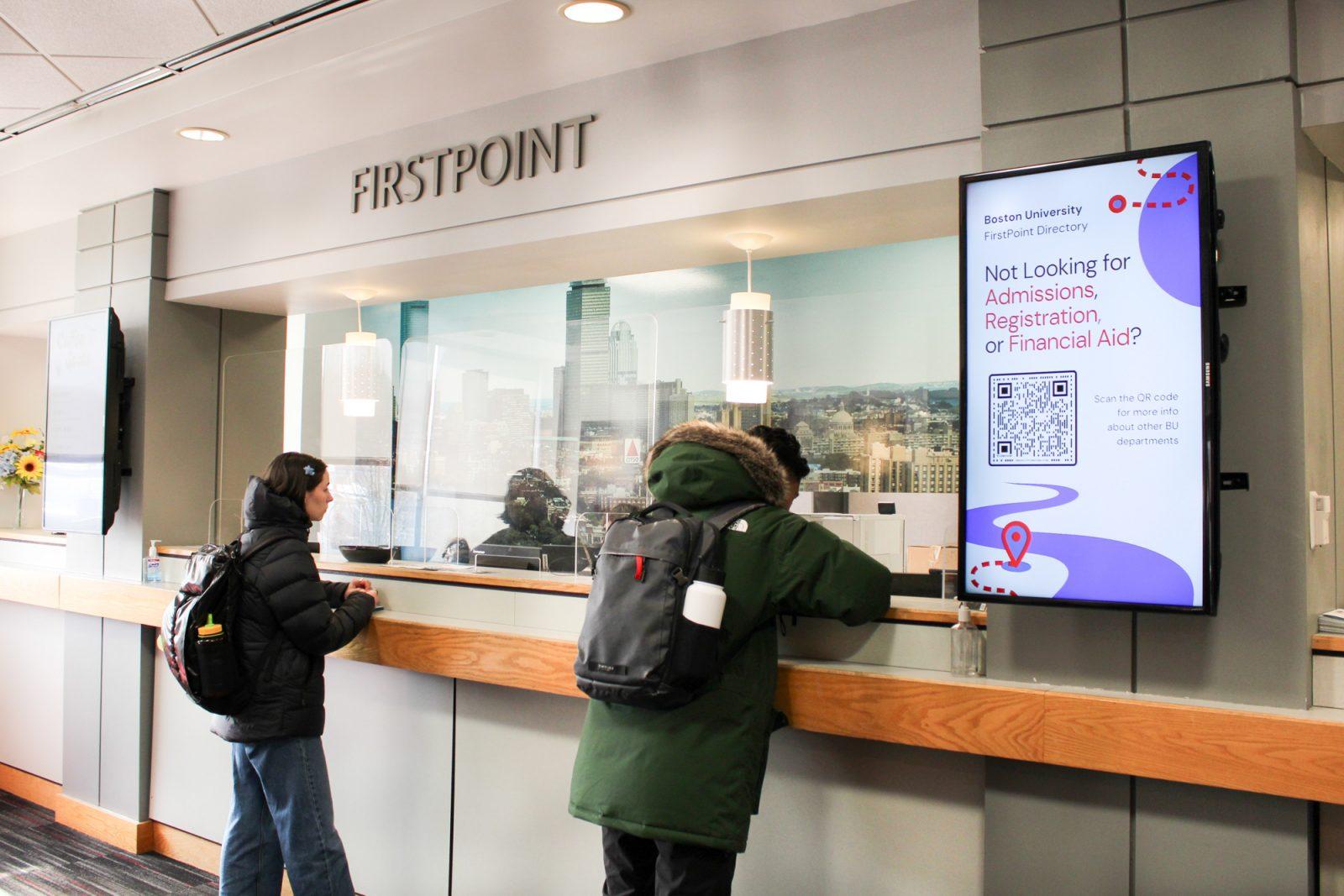 Students approach the window at FirstPoint Office. Inconsistencies in the allocation of MASSGrant, a need-based financial aid program awarded to eligible undergraduate Massachusetts residents based on their Free Application for Federal Student Aid, sparks confusion among Boston University students. LAUREN ALBANO/DFP PHOTOGRAPHER 
