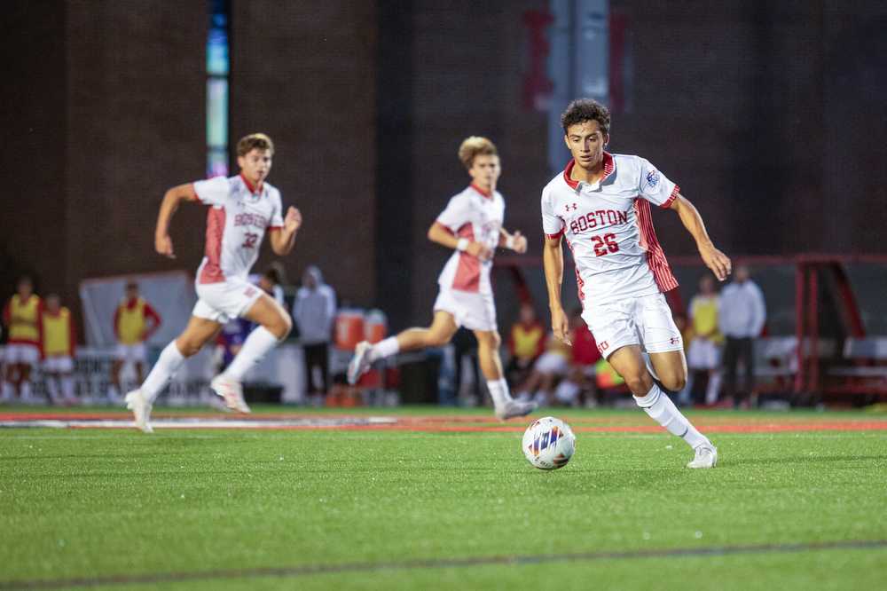 Freshman midfielder Jason Zacarias (26) dribbles down the field during a match against The College of the Holy Cross on Wednesday. The Boston University Terriers beat Holy Cross 3-0. HALEY ALVAREZ-LAUTO/DFP PHOTOGRAPHER
