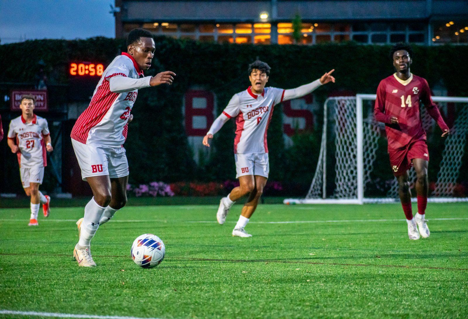 Junior forward Damola Salami (25) kicks a pass down the field in a game against Boston College on Sept. 24. The Terriers lost 3-1 against Lehigh in an away game on Saturday. KELLY BRODER/DFP PHOTOGRAPHER
