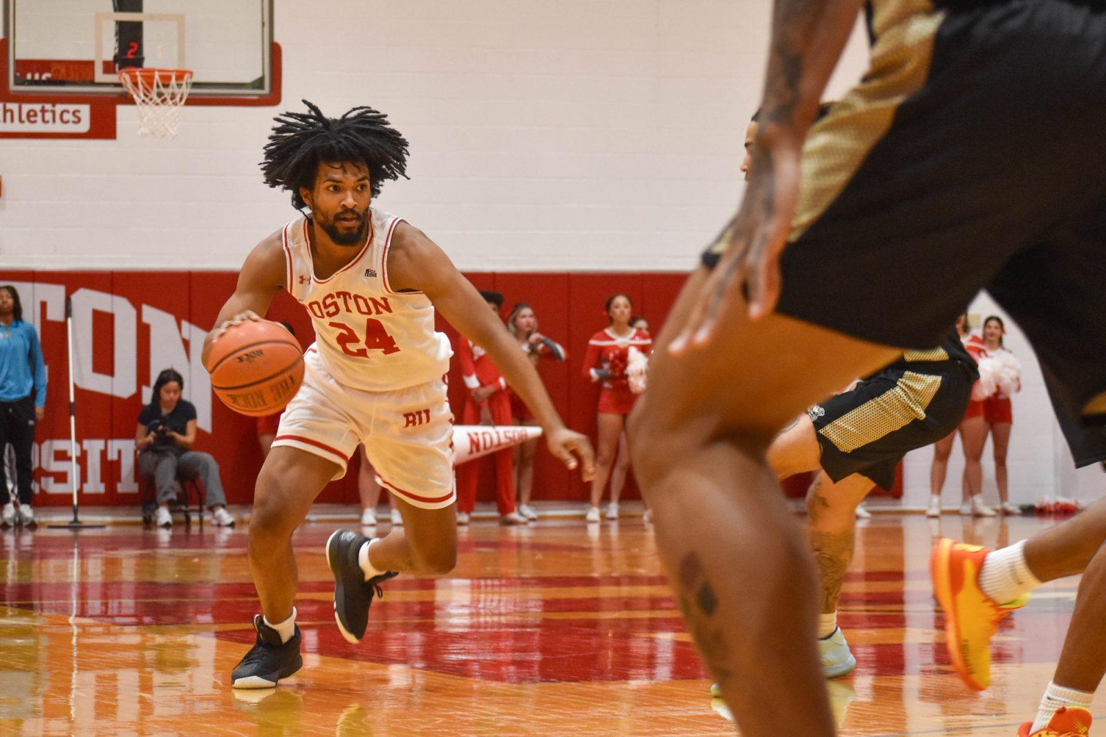 Boston University senior guard Miles Brewster (24) dribbles down the court during a game against Bryant University on Nov. 16. The Terriers narrowly beat Loyola Maryland 82-79 on Sunday. KELLY BRODER/DFP PHOTOGRAPHER