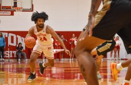 Boston University senior guard Miles Brewster (24) dribbles down the court during a game against Bryant University earlier this season. The Terriers beat Sacred Heart 70-49 on Saturday. KELLY BRODER/DFP FILE
