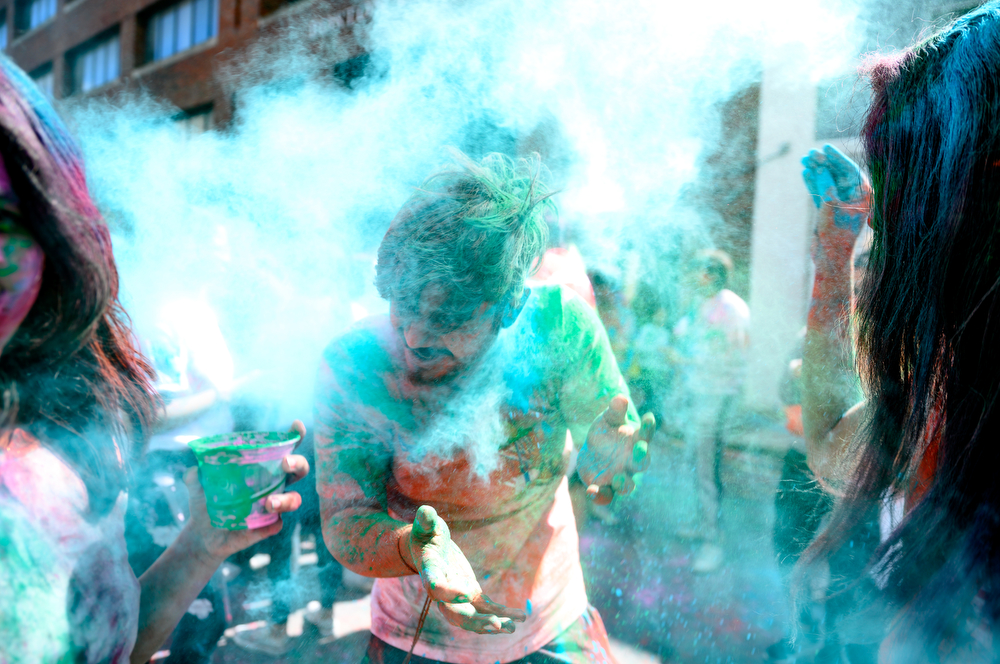 A participant gets covered in blue powder