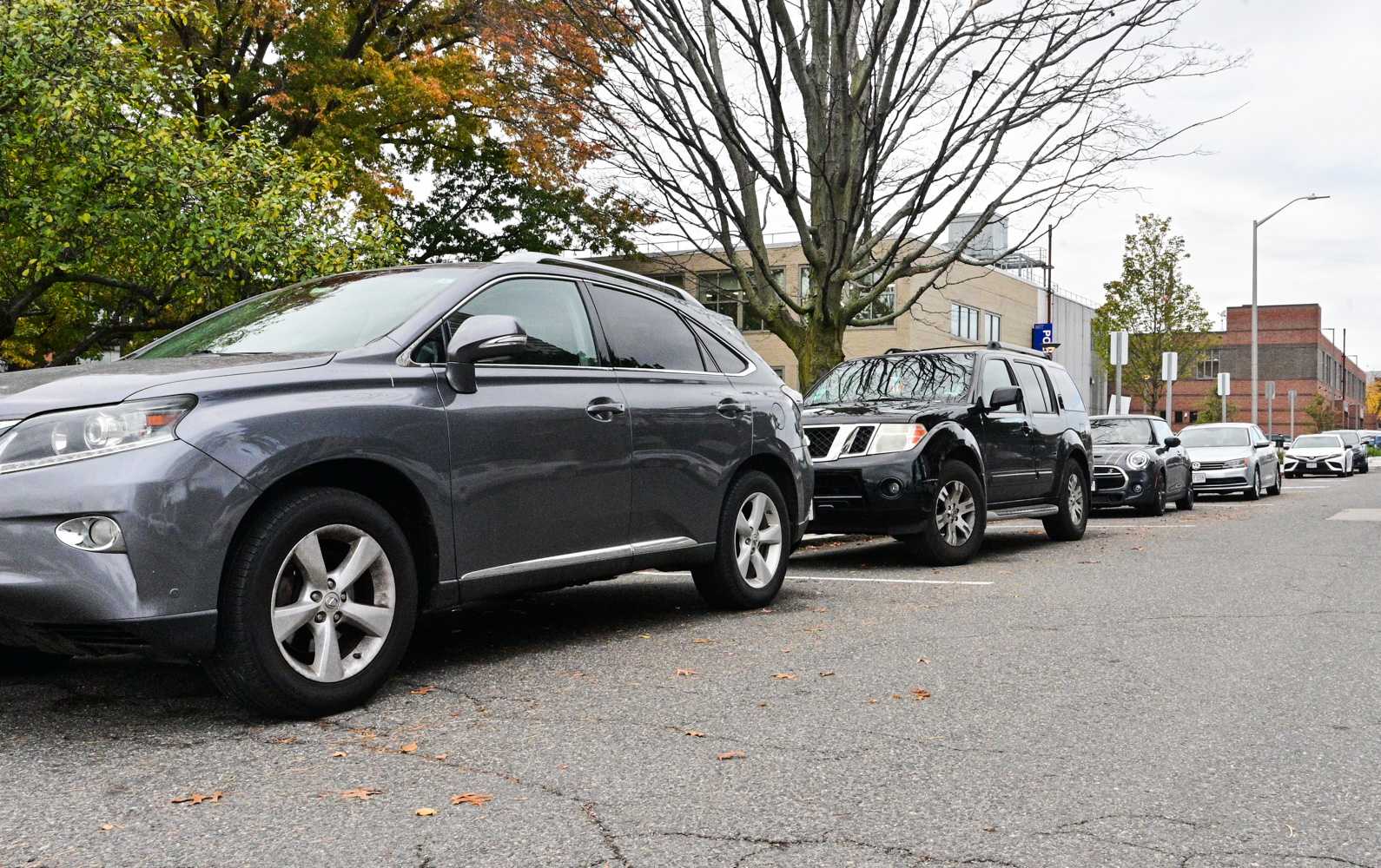 Cars parked on Audrey Street in Cambridge. The Cambridge City Council eliminated parking requirements in the zoning code, allowing developers to use the space for affordable housing, sustainable transportation and other commercial uses. ANDREW BURKE-STEVENSON/DFP STAFF
