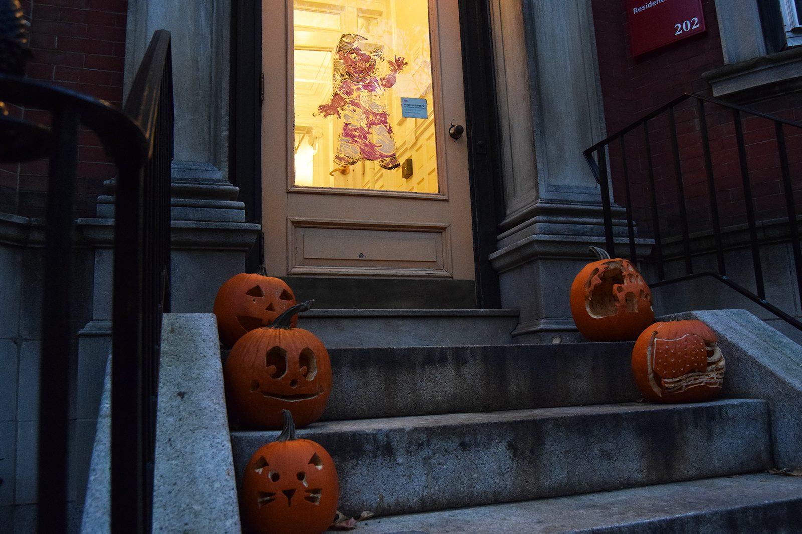 Jack-o-lanterns sitting outside a Boston University residence building. The BU Campus Activities Board is putting on several Halloween-themed events to get students in the spooky spirit this year. ELLEN CLOUSE/ DFP FILE
