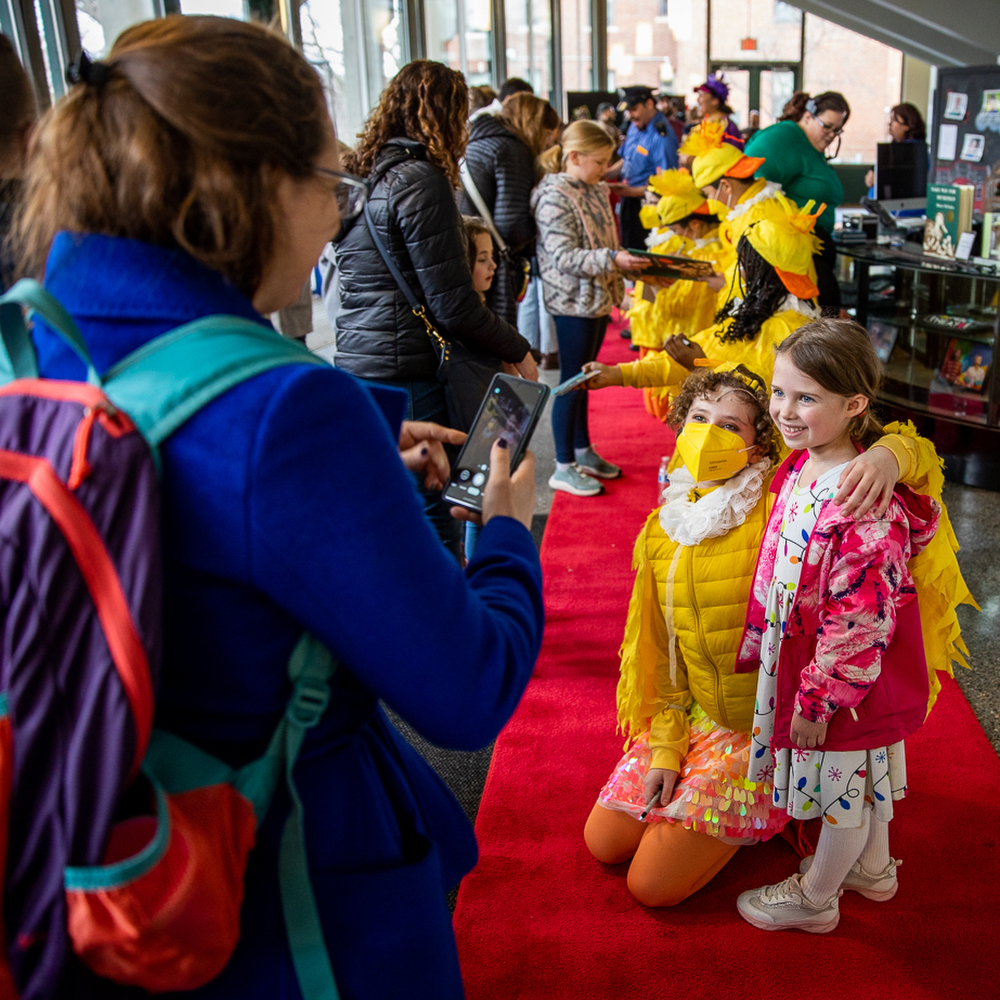 Evelyn Dunphy, 5, poses for a photo after the show with “Mack” the duckling, portrayed by Echo Kaufman.